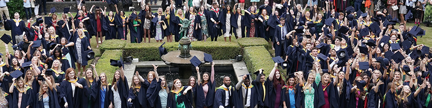 Graduates celebrate in the Library Quad